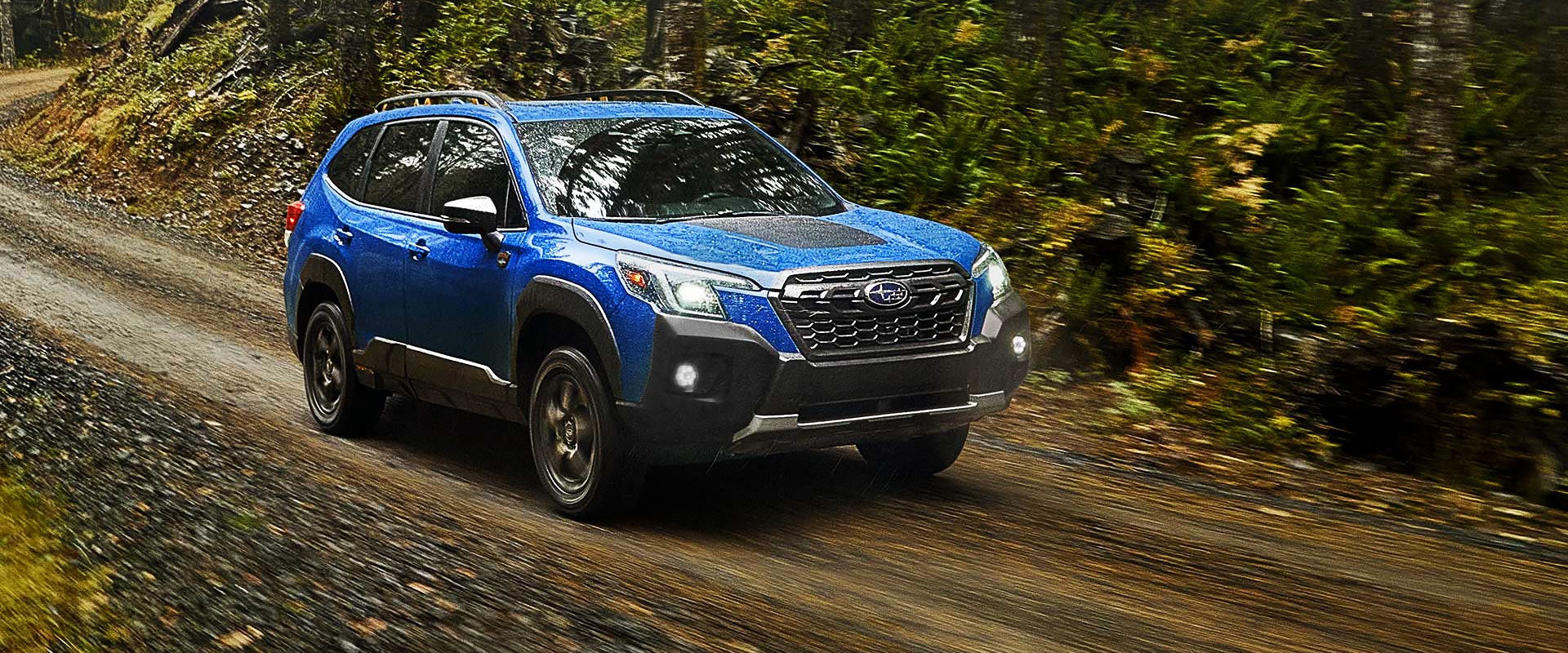 A 2022 Forester driving on a highway. | Sierra Subaru of Monrovia in Monrovia CA