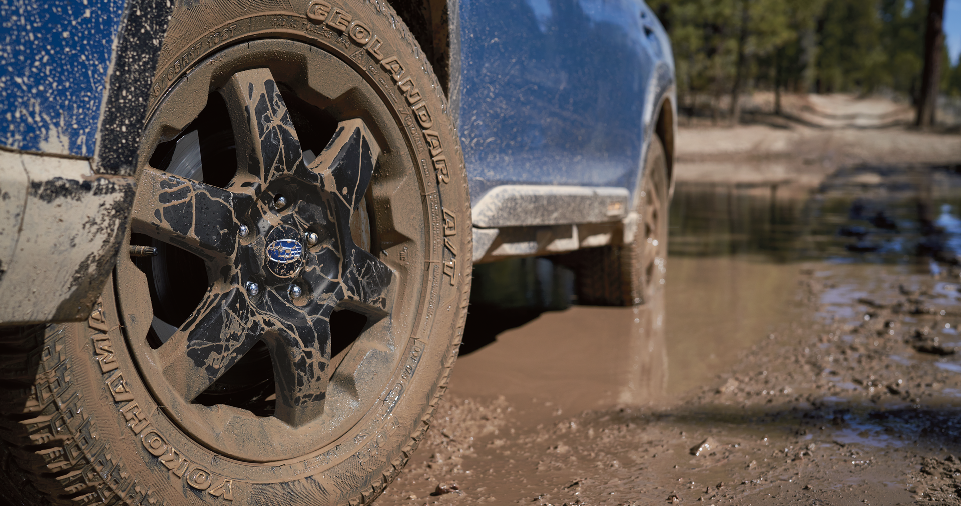 A close-up of the 17-inch off-road wheels and all-terrain Yokohama GEOLANDAR® tires on the 2023 Outback Wilderness. | Sierra Subaru of Monrovia in Monrovia CA